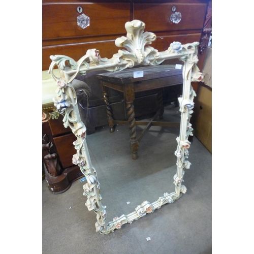 338 - An Italian style plaster cherub console table and mirror