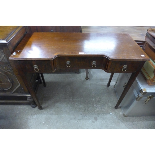 343 - A Regency style mahogany three drawer side table