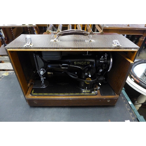 354 - An electric Singer sewing machine in a faux crocodile skin case