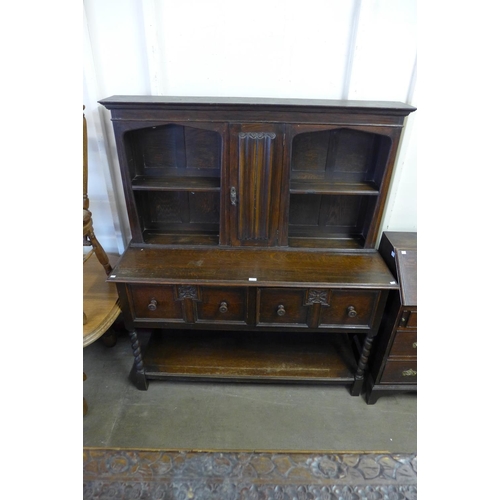 357 - A carved oak barleytwist dresser