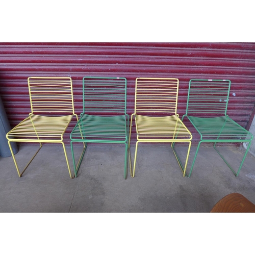 377 - A set of four metal stacking chairs