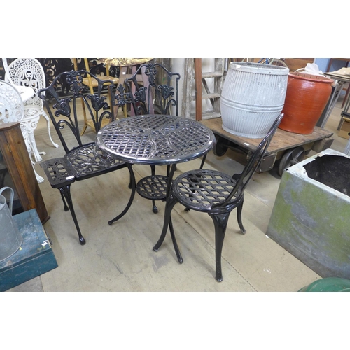 397 - A painted metal three piece bistro set