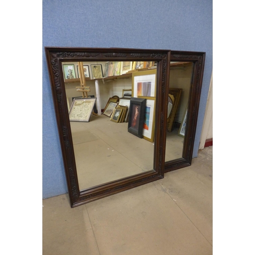 432 - A pair of carved walnut framed mirrors