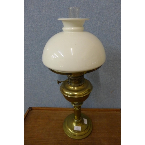 441 - A brass oil lamp with white glass shade