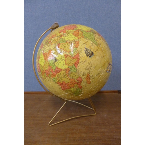 443 - A jigsaw terrestrial globe on stand