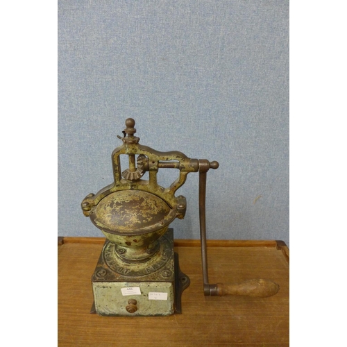 446 - A cast iron coffee grinder with painted wooden drawer by Peugeot Freres