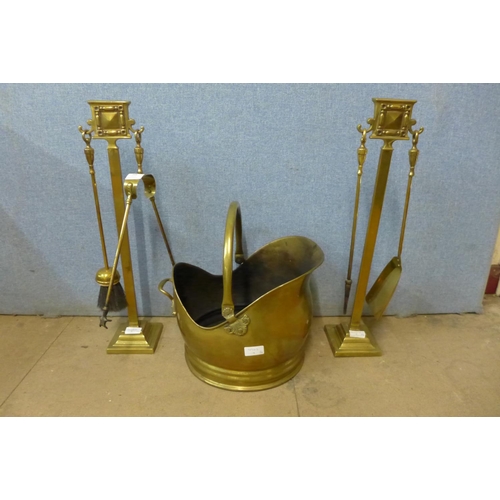 448 - A brass companion set and a brass coal bucket