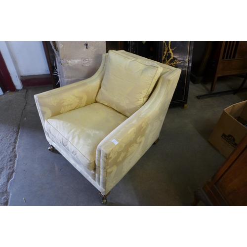 83 - A Regency style mahogany and fabric upholstered armchair