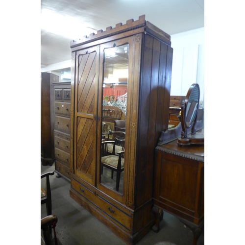 85 - A Victorian Aesthetic Movement inlaid ash wardrobe, manner of Bruce Talbert