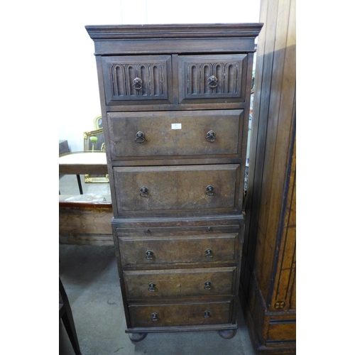 86 - A 17th century style carved oak and walnut chest on chest