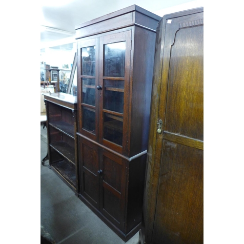 87 - An early 20th Century oak four door bookcase