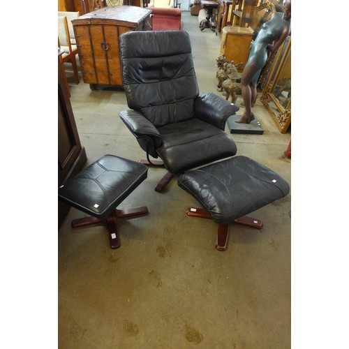 348a - A black leather swivel armchair and two stools