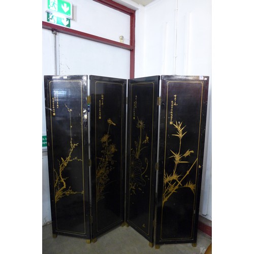 333 - A Chinese black lacquered chinoiserie folding dressing screen, a/f