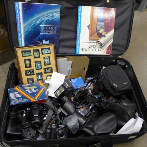 1180 - A collection of cameras and equipment, Nikon Coolpix P500, Panasonic Lumix, JVC Everion, a 10x50 spo... 