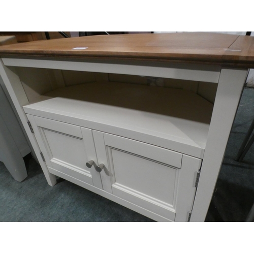 3155 - A cream painted two door corner TV unit * This lot is subject to VAT