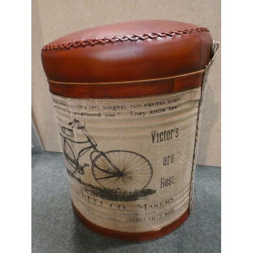 3179 - A tin upholstered bike print footstool * This lot is subject to VAT