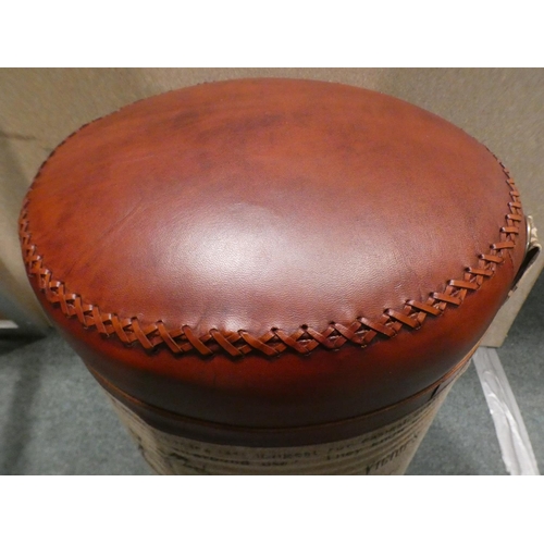 3179 - A tin upholstered bike print footstool * This lot is subject to VAT