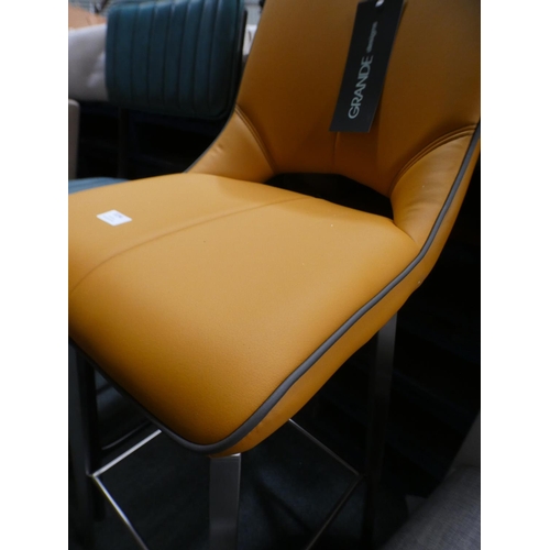 3194 - A mustard upholstered swivel barstool * This lot is subject to VAT