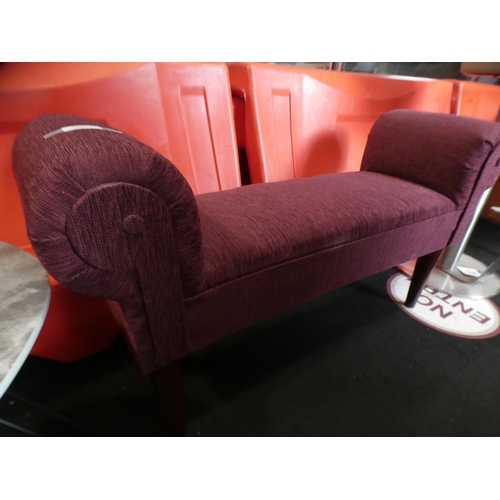 3208 - A maroon fabric footstool * This lot is subject to VAT
