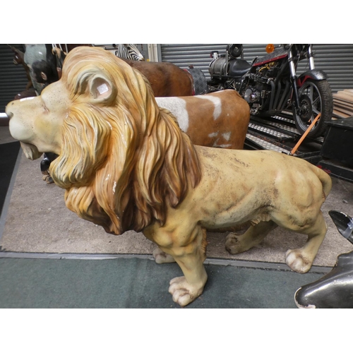3228 - A fibreglass adult male lion (approx. 4' 5