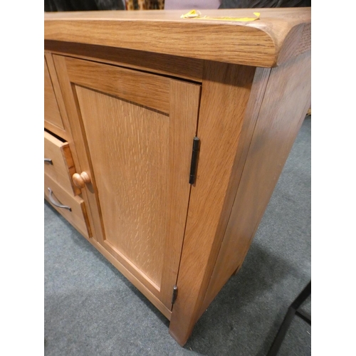 3158 - An oak two door, three drawer sideboard * This lot is subject to VAT
