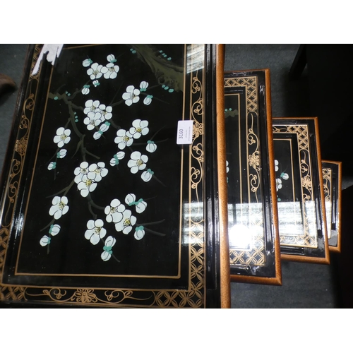 3160 - A traditional patterned black and glass topped nest of four tables (minor cracks/damaged) * This lot... 
