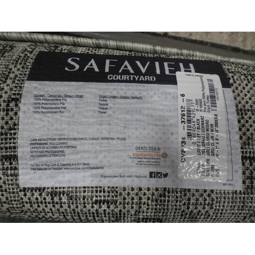 3284 - A black and white flatweave rug (200cm x 300cm) * This lot is subject to VAT