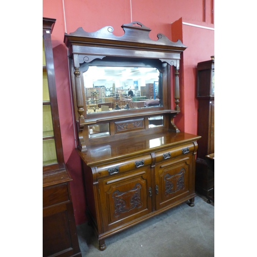 68 - An Edward VII carved walnut mirrorback sideboard