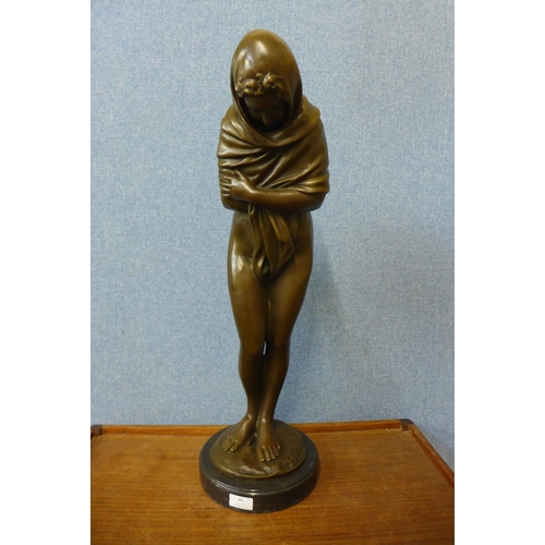 43 - A large French style bronze figure of a semi-nude bathing female, on black marble socle, 69cms h