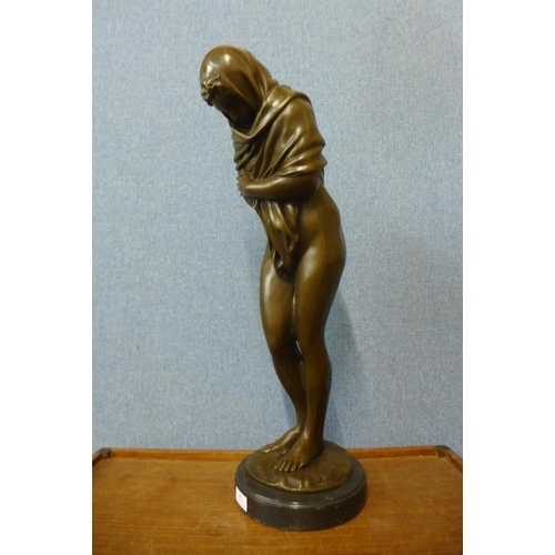 43 - A large French style bronze figure of a semi-nude bathing female, on black marble socle, 69cms h