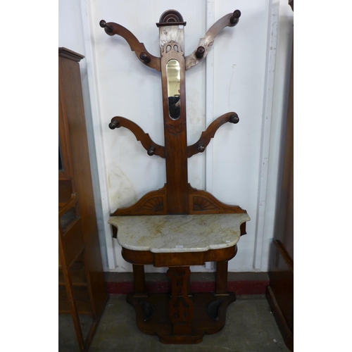 54 - A Victorian walnut and marble topped tree shaped hallstand