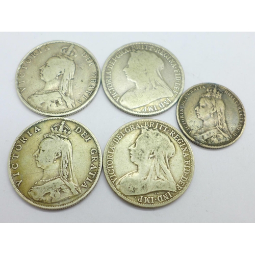 1015 - Five Victorian coins; two crowned head florins and a shilling, and two veiled head florins, 49.3g