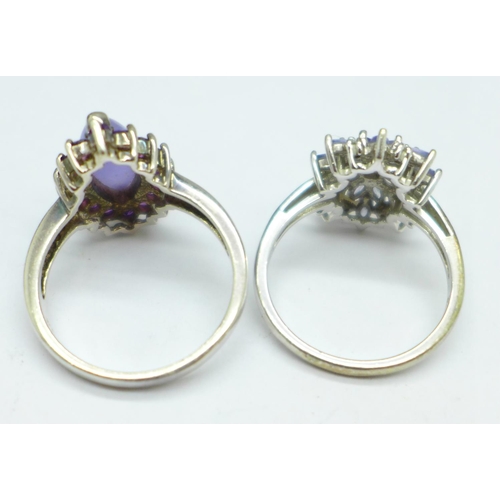 1017 - Two silver stone set rings, T and U