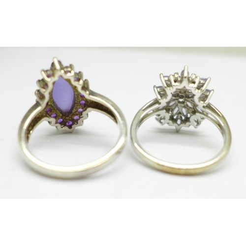 1017 - Two silver stone set rings, T and U