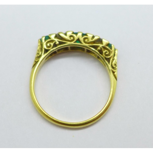 1029 - An 18ct gold, emerald and diamond ring, 4.2g, O