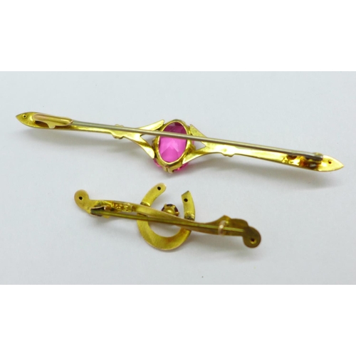 1034 - Two 9ct gold brooches; horseshoe with red stone and one set with a pink stone, total weight 3.1g