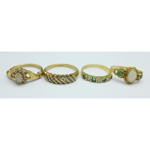 1041 - Four 9ct gold rings, two set with opals, total weight 9.1g, M, 2x P and S