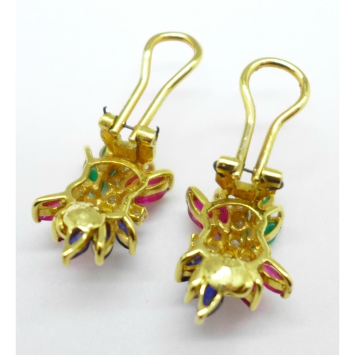 1044 - A pair of yellow metal coloured stone set clip-on earrings, 9.1g