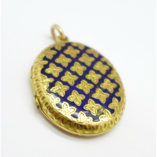 1045 - A yellow metal locket, enamel a/f, 6.6g, 24mm x 29mm