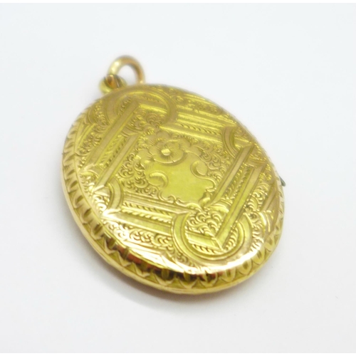 1045 - A yellow metal locket, enamel a/f, 6.6g, 24mm x 29mm