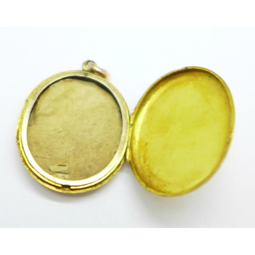 1045 - A yellow metal locket, enamel a/f, 6.6g, 24mm x 29mm