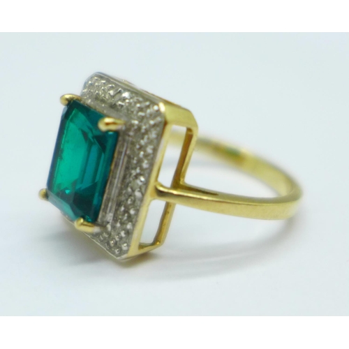 1047 - A 9ct gold and green stone ring, also set with four small diamonds, 3g, M