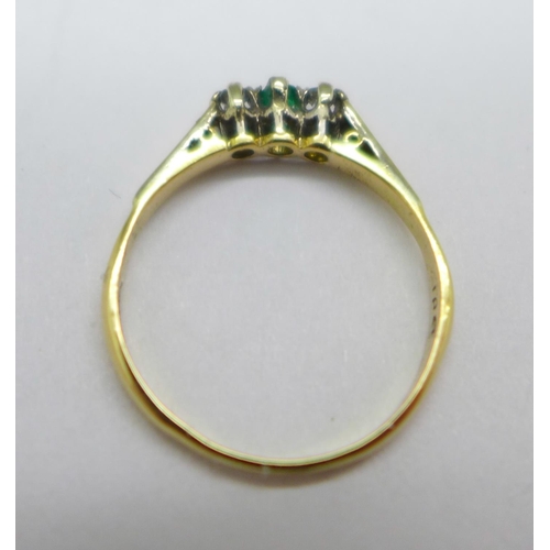 1053 - An 18ct gold, emerald and diamond three stone ring, 1.7g, N