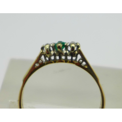 1053 - An 18ct gold, emerald and diamond three stone ring, 1.7g, N