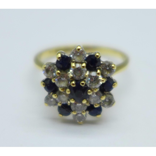 1054 - A 9ct gold, sapphire and cubic zirconia ring, 3.4g, O