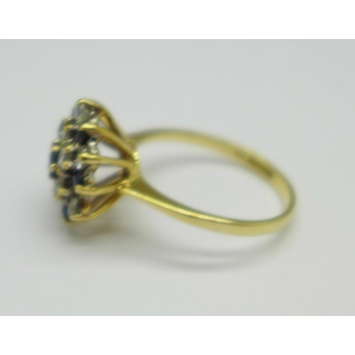 1054 - A 9ct gold, sapphire and cubic zirconia ring, 3.4g, O