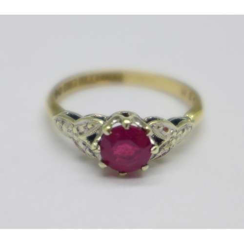 1057 - A 9ct gold and ruby solitaire ring, 2g, K