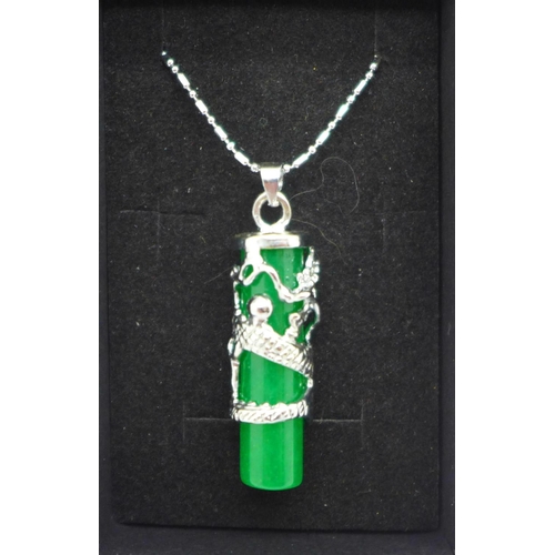 1071 - A rhodium plated silver and jadeite pendant and chain