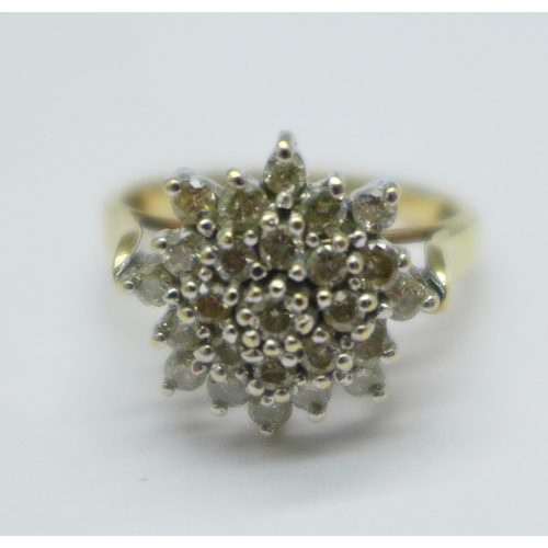 1074 - A 9ct gold, twenty-five stone diamond cluster ring, 4.9g, S