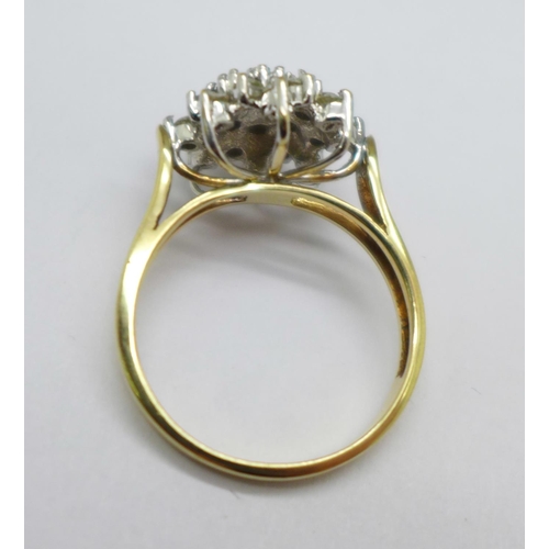 1074 - A 9ct gold, twenty-five stone diamond cluster ring, 4.9g, S